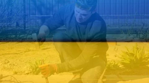 Defocus construction worker removing irregularities on floor screed with hamm Stock Photos