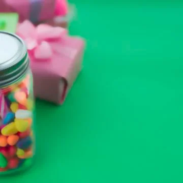 Defocus Festive composition set of gift boxes with balls candy cocktail mater Stock Photos