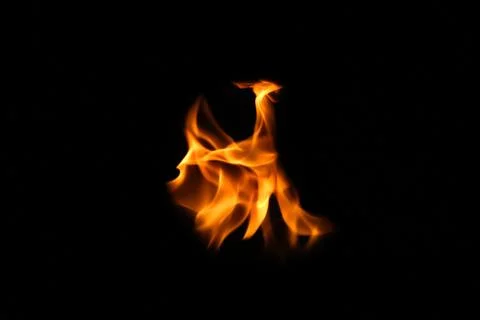 Defocus fire flames. Eagle silhouette Fire embers particles over black back.. Stock Photos