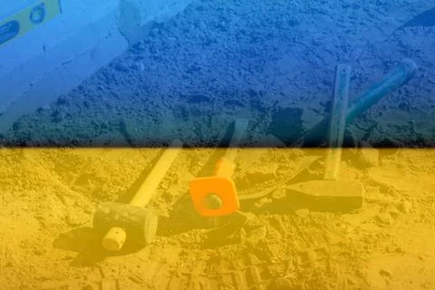 Defocus hammer, mallet, chisel and bayonet of the shovel lie on the ground. S Stock Photos