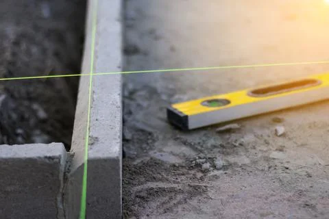 Defocus level tool. Construction industry. Yellow level tool spirit and green Stock Photos