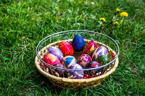 Defocus multicolored easter eggs. Decorated pysanka and krashanka. Wooden Basket Stock Photos