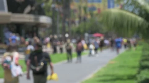 Defocus / Out of focus attendees walk outside Comic-Con, rack focus attendees Stock Footage 246635380