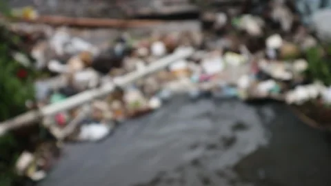 Defocus : Plastic bottle waste pollutes river water. Stock Footage 325027879
