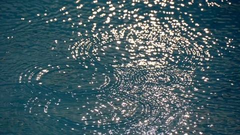 Defocus Ripples, sun glare on waves water. Sea ripples. Sun glare on blue Stock Footage 134630472