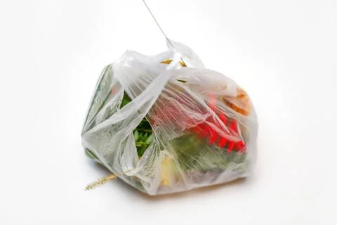 DEFOCUS. Save environmental. Red and green plants flowers in a plastic bag on Stock Photos