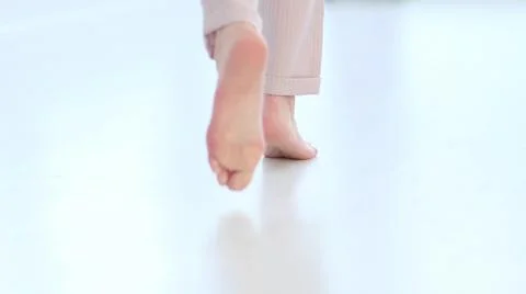 Defocus, Side close up view of unrecognizable woman feet legs, barefoot girl Stock Photos