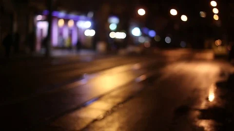 Defocus, soft focus. night city, wet asphalt, old tram calls into the frame, Eur Stock Footage 74374836