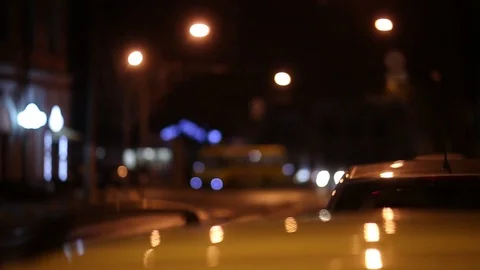 Defocus, soft focus. night city, wet asphalt, old tram calls into the frame, Eur Stock Footage 74374845