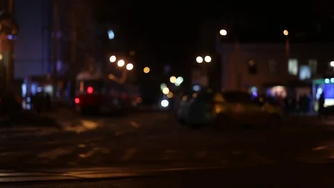 Defocus, soft focus. night city, wet asphalt, old tram calls into the frame, Eur Stock Footage 74374860