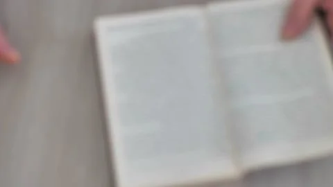 Defocus, top view. man chooses a book instead of a phone Stock Footage 175362331