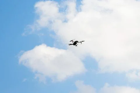 Defocus war drone. Drone flying in a blue sky. The black army unmanned aerial Stock Photos