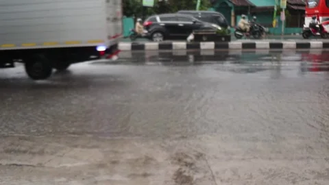 Defocus Water splashes on the road from the wheels of vehicles Stock Footage 296145216