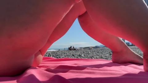 Defocused 4K video. Out of focus view of sea shore from female legs Stock Footage 332808865