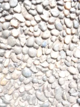 Defocused abstrack background of white pebbles Stock Photos