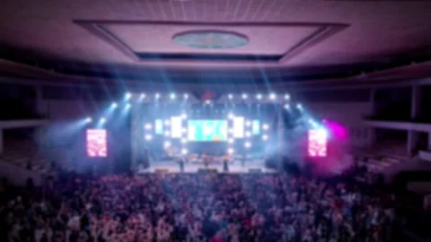 Defocused Abstract Background of Cheering concert crowd with colorful show light Stock Footage 294274496