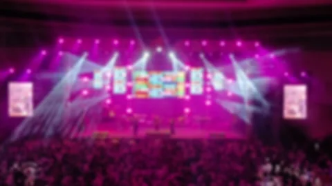 Defocused Abstract Background of Cheering concert crowd with colorful show light Video stock 294274538