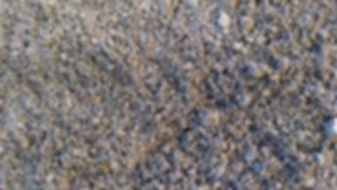 Defocused abstract background of gray sand Stock Photos