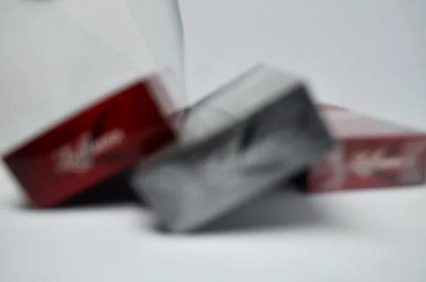 Defocused abstract background isolated of a red pack cigarettes Stock Photos