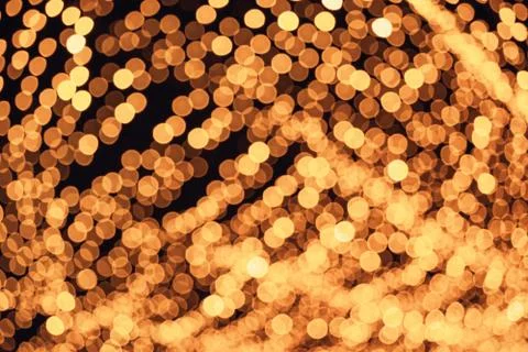 Defocused abstract bokeh pattern from lighting decor for background. Stock Photos