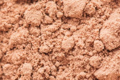 Defocused abstract rough ground red soil texture or dry cocoa powder backgrou Stock Photos