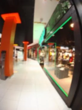 Defocused and blurred vertical image of a large shopping mall Stock Photos