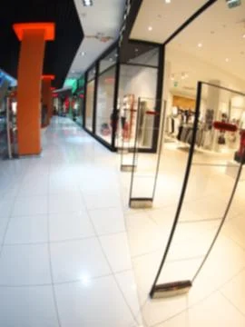 Defocused and blurred vertical image of a large shopping mall Stock Photos