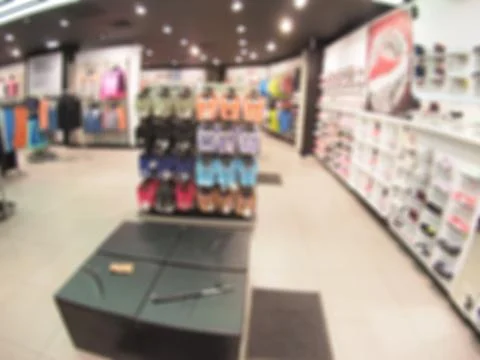 Defocused and blurry image of the interior of the shoe store Stock Photos