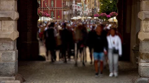 Defocused and motion blurred time lapse of crowds of people walking on busy Stock Footage 253282489