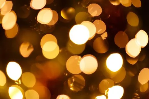 Defocused background with blinking lights of christmas garland Stock Photos