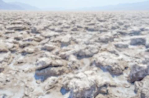 Defocused background of Devil's Golf Course in Death Valley, California Stock Photos