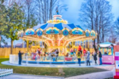 Defocused background of an old fashioned carousel at dusk Foto stock