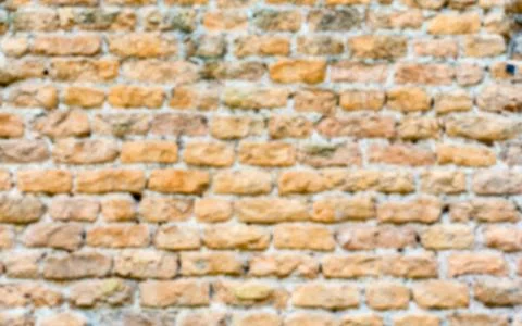 Defocused background of stone brick wall texture with copy space Stock Photos