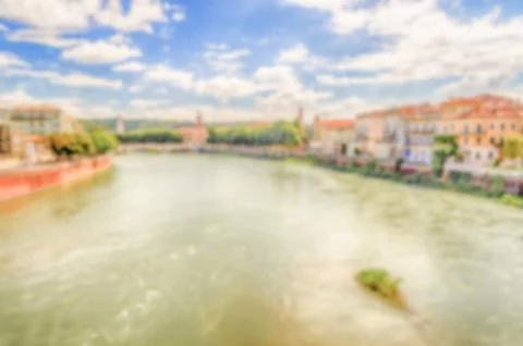 Defocused background with view over Adige River in Verona, Italy Stock Photos