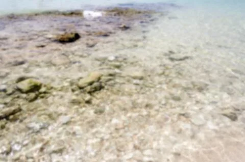 Defocused background of white sandy beach in Salento, Italy Stock Photos