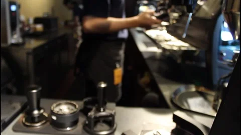 Defocused barista is using coffee tamper Stock Footage 342613609