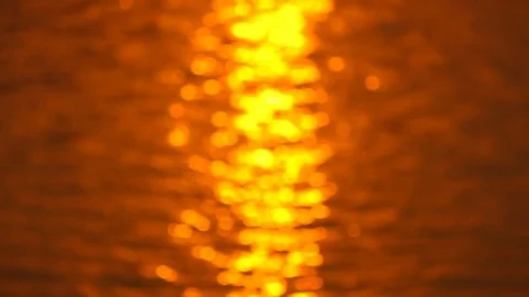 Defocused of beautiful warm sunset reflections on water surface Stock Footage 79435343