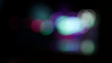 Defocused blinking lights of a moving carousel ride Stock Footage 120138483