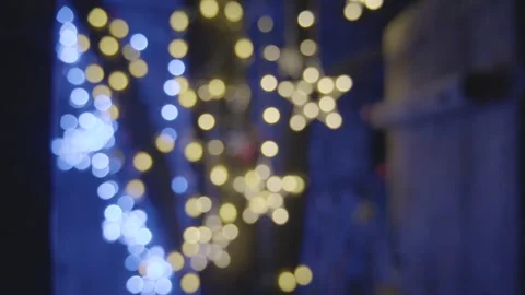Defocused Blue and Yellow String Lights Indoors at Night in Beijing, China Stock Footage 345750557