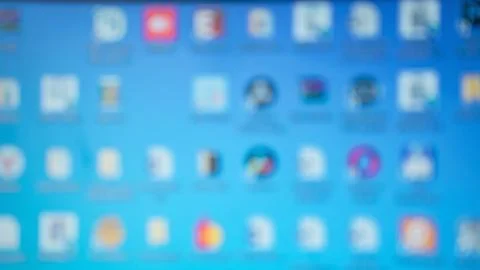 Defocused blue colored computer desktop with blurred folders Stock Photos