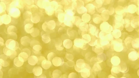 Defocused blurred background. The bokeh lights up in yellow gold. 4k holiday or Stock Footage 170747514
