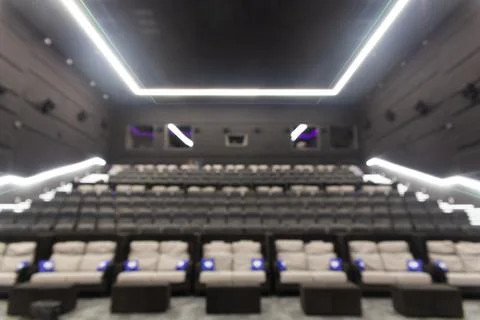 Defocused blurred image of empty black leather seats at movie theater Fotos Stock