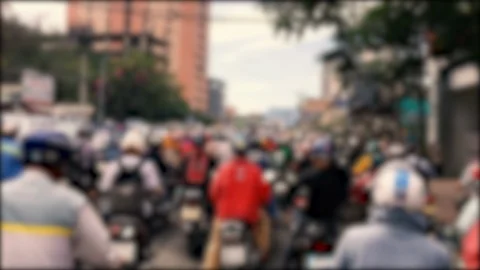 Defocused, blurred of slow moving traffic with lots of motorcycles, motorbike Stock Footage 111138894