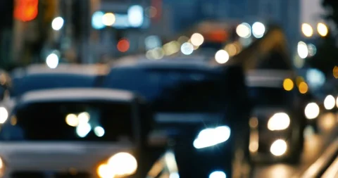 Defocused, blurry, blurred of slow moving traffic with lots of motorcycles, car Stock Footage 104087567
