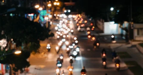 Defocused, blurry, blurred of slow-moving traffic with lots motorcycles, car Stock Footage 115050947