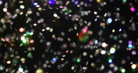 Defocused bokeh colored particles inside a glass Christmas ball.	 Video stock 168181695