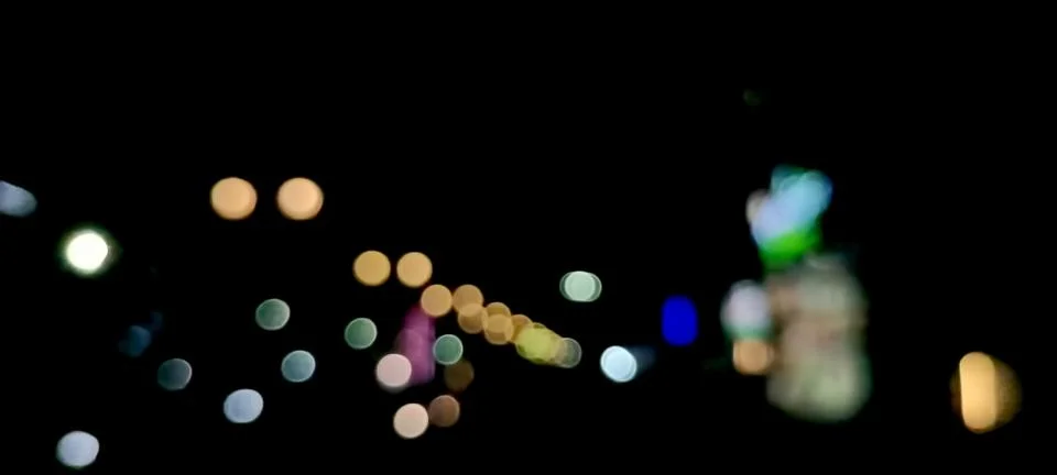 Defocused Bokeh Lights Abstract texture. Night Bokeh Light In Big City Stock Photos