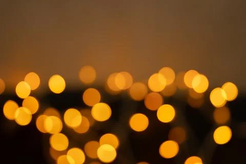 Defocused bokeh lights on black background, an abstract naturally blurred Stock Photos