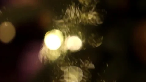 Defocused bright lights on a christmas tree decorated with christmas toys Stock-Footage 70749959