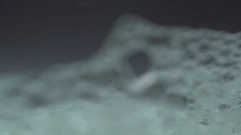 Defocused bubbles macro close up intimate with light sweeping frame Stock Footage 119127579